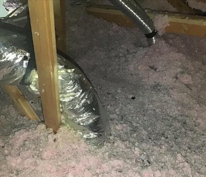 attic insulation covered in soot