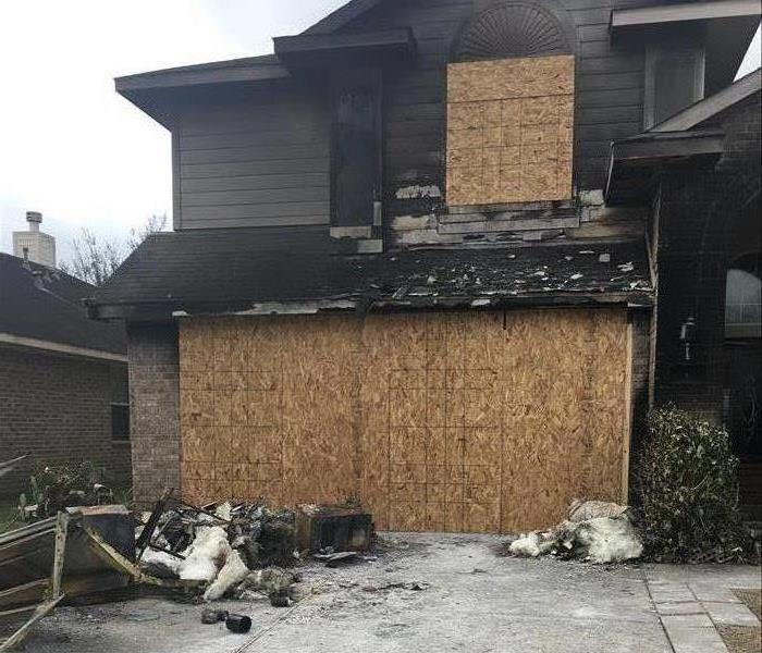 Burnt home boarded up